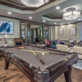 Modern resident lounge with a billards table and entertaining space at Camden Asbury Village in Raleigh, NC