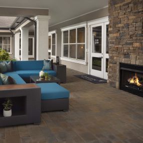 Enjoy the serenity at our outdoor lounge, featuring a fireplace just right outside our Resident Lounge