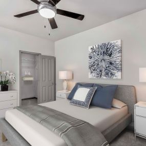 Spacious bedroom with ceiling fan and attached walk-in closet at Camden Asbury Village in Raleigh, NC.