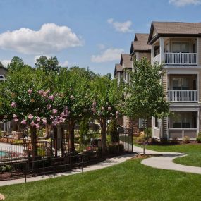 Exterior buildings and walking path at Camden Asbury Village in Raleigh, NC