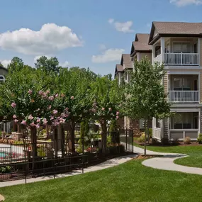 Exterior buildings and walking path at Camden Asbury Village in Raleigh, NC