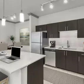 Large kitchen with stainless steel appliances and center island at Camden Asbury Village in Raleigh, NC