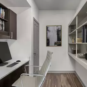 Office space with built-in desk, shelving, and closet at Camden Asbury Village in Raleigh, NC.