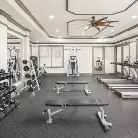 Camden Asbury Village apartments 24-hour fitness center with cardio machines and free weights, located in Raleigh, NC