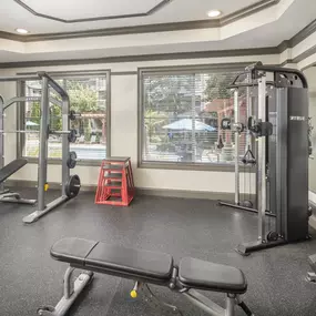 Camden Asbury Village Apartments fitness center with a power rack and powerline machine located in Raleigh, NC