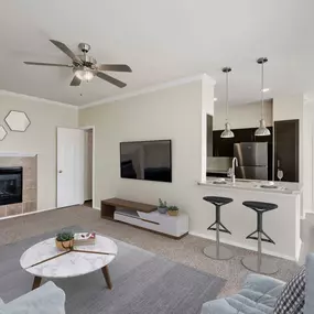 Living roo with fireplace open to kitchen