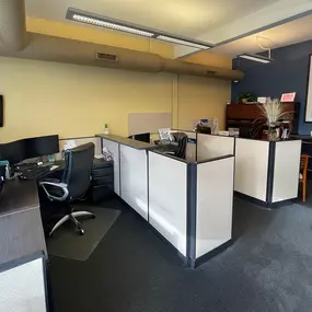 A few desks inside our agency, including Lori's desk