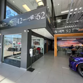 Jeff Wyler Chrysler Dodge Jeep Ram of Fort Thomas customer lounge and service consultation area showcased in this photo, offering a comfortable and modern space for guests while their vehicles receive expert maintenance and repair service near Northern Kentucky