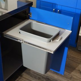It’s all in the details! When we create an Outdoor Kitchen, we think of everything—including this under-cabinet waste basket so that you can keep your outdoor counters tidy!