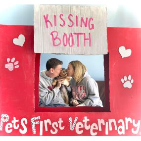 kissing booth with puppy