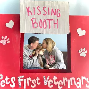 kissing booth with puppy