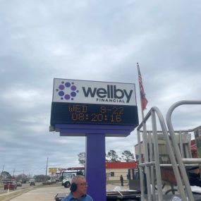 Exterior signage of Wellby Financial in La Porte