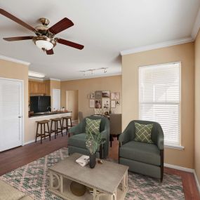 Spacious living room with hardwood-style floors and 9-foot ceilings