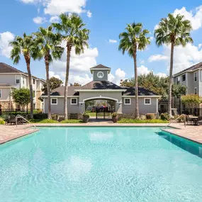 Resort-style pool with Lounge Seating at Camden Downs at Cinco Ranch in Katy, TX.