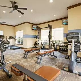 24-hour fitness center with strength and cardio equipment