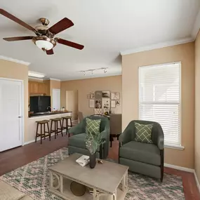 Spacious living room with hardwood-style floors and 9-foot ceilings