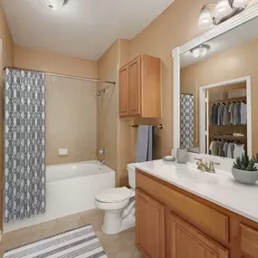 Bathroom with soaking bathtub and tile surround