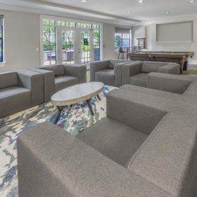 Resident lounge with billiards table, lounge seating, and cloud printer