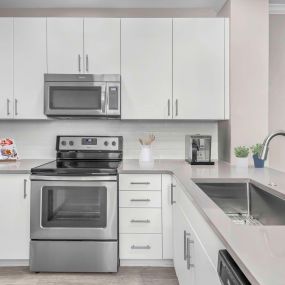 Kitchen with stainless steel appliances and large sink