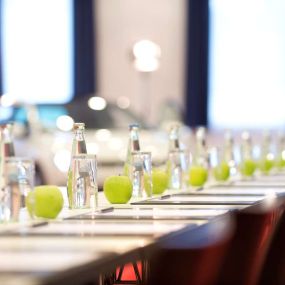 Conference Centre Apples and Water On Tables