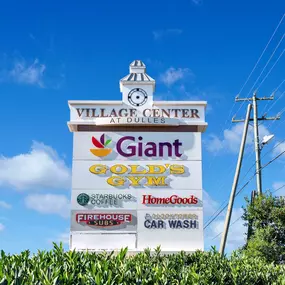 Village Center at Dulles Entrance Sign Nearby Camden Dulles Station in Herndon, Virginia