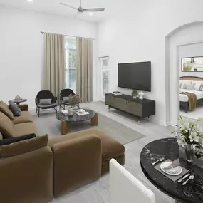 Open-concept living with wood-style flooring throughout on first-floor apartment homes at Camden Dulles Station in Herndon, VA