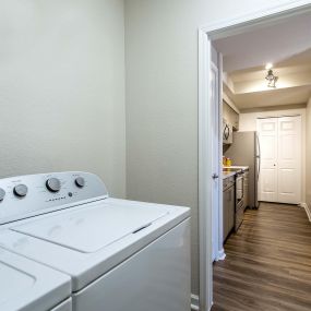 One bedroom full size washer and dryer in laundry room