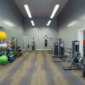 Fitness center with strength training equipment and free weights