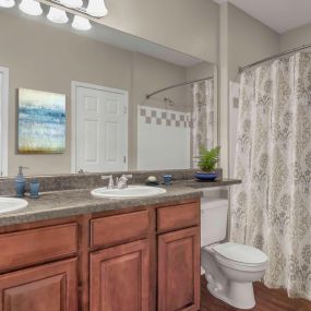 Bathroom with bathtub and shower combination and tile surround