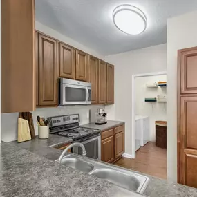 Kitchen with adjacent laundry area