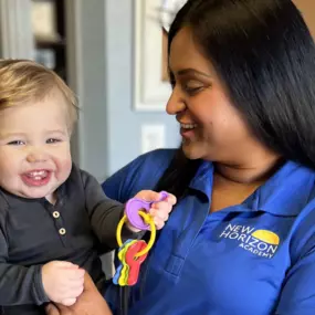 Teacher and Child at New Horizon Academy Burnsville.