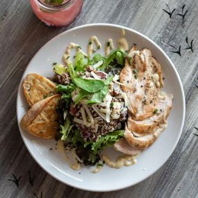 This Chicken Waldorf salad showed up on our menu a few months ago and it has been a hit ever since!  We start with a pile of organic spring mix and add quinoa, green apples, red grapes, candied nuts, and gruyere cheese.  Topped with a grilled organic chicken breast and our famous Tipsy dressing. Perfect for lunch or dinner!