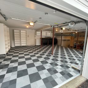 Functional and stylish, this Swisstax floor is a great flooring option for a garage that has water flowing in constantly.