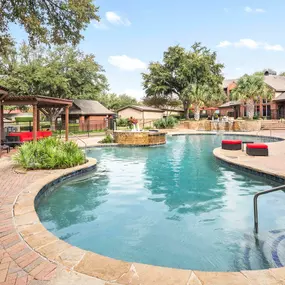 Resort-style pool with covered cabana seating at Camden Centreport