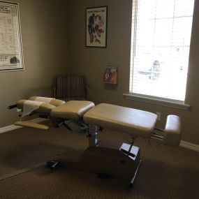 chiropractic table in treatment room