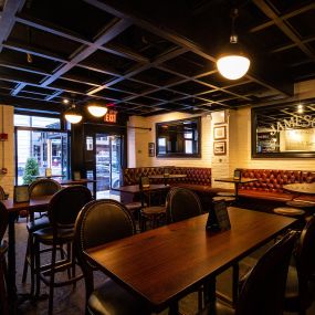 The Grill Room with comfy tall booths and high top tables in The Long Room in Midtown Manhattan