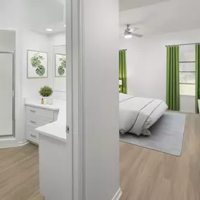 Bedroom with ensuite bathroom and wood-style floors