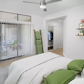 Bedroom with wood-style floors throughout and patio access