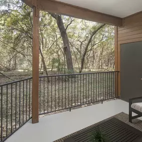 Spacious patio with storage closet looking out into the Austin greenbelt at Camden Gaines Ranch