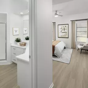 Primary bedroom and ensuite bathroom with wood-style flooring and walk-in shower at Camden Gaines Ranch apartments in Austin, TX