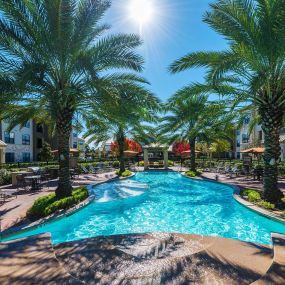 Beach style pool with grilling areas