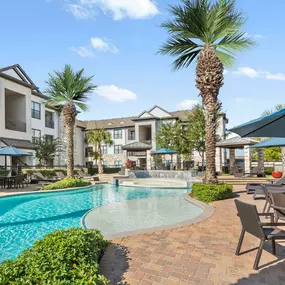 Tanning Deck and Water Feature at the Resort-Style Pool