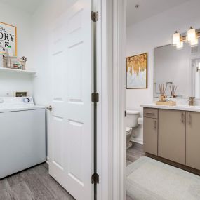 Luxurious bathroom and full-size washer and dryer at Camden Landmark Apartments in Ontario CA