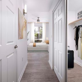 Spacious bedroom with closet with wooden rods and shelves at Camden Landmark Apartments in Ontario CA