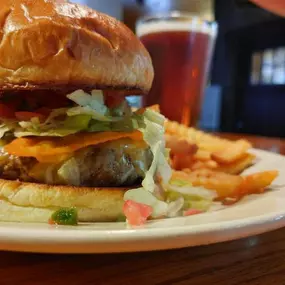 Enjoy our 5oz patty seasoned taco style topped with shredded cheese, Doritos, shredded lettuce and pico de gallo. Served with fries for only $7.99!