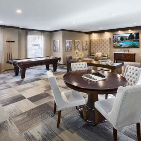 Resident game room with billiards and shuffleboard at Camden Midtown Apartments in Houston, TX