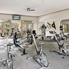 Fitness center with cardio equipment at Camden Midtown Apartments in Houston, TX