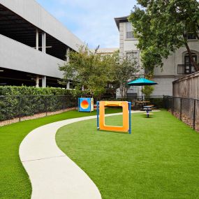 Private dog park with seating at Camden Midtown Apartments in Houston, TX