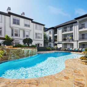 Resort-style pool with water feature at Camden Midtown Apartments in Houston, TX