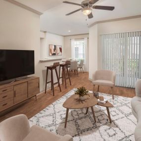 Open concept living room with direct access to patio at Camden Midtown Apartments in Houston, TX